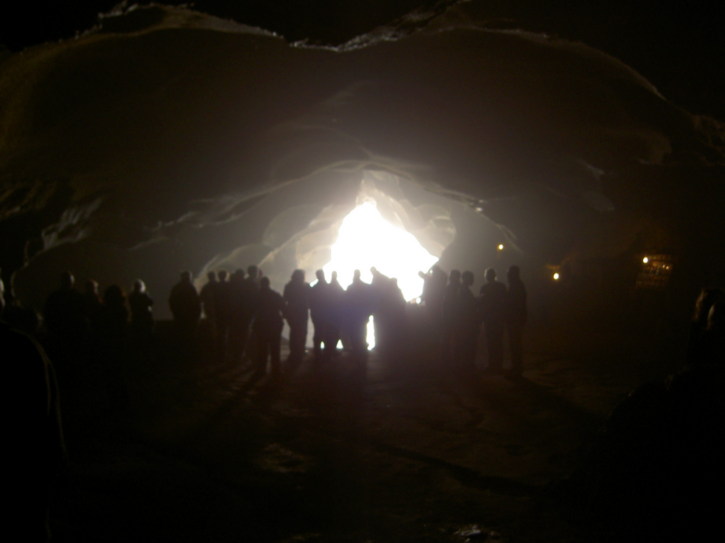 People look outside a cave