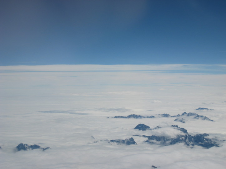 Mountains poke through the clouds