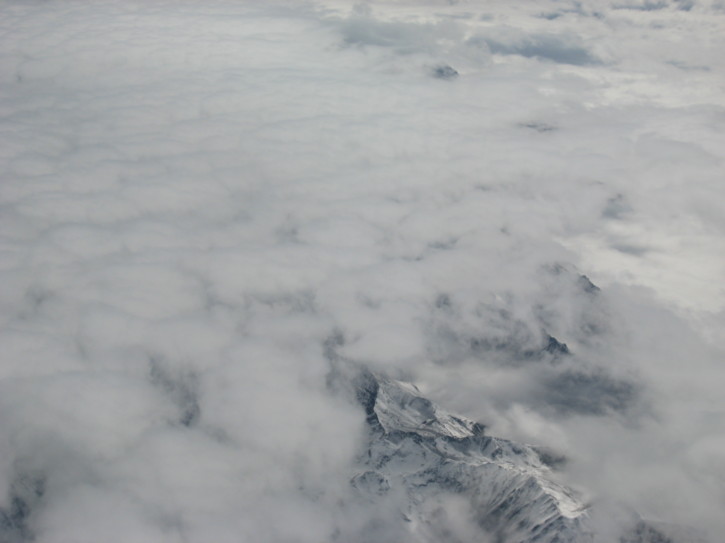 Mountains poke through the clouds
