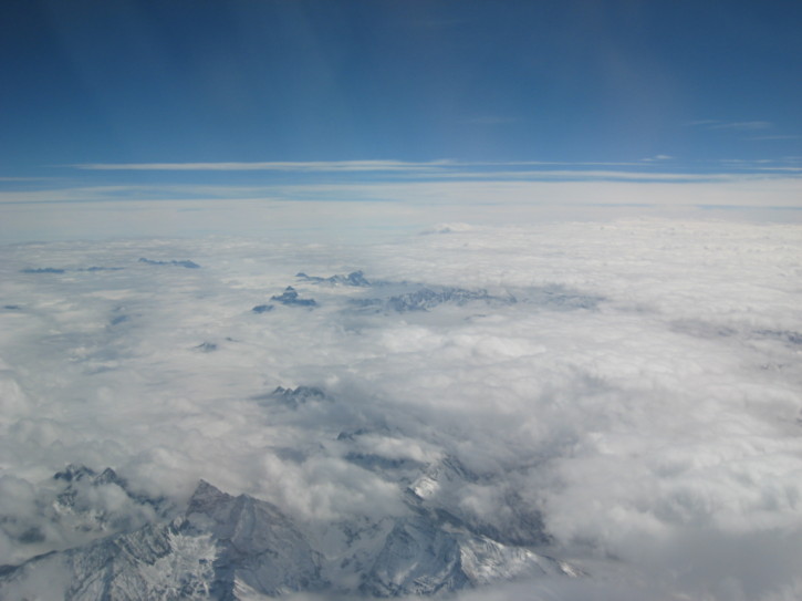 Mountains poke through the clouds