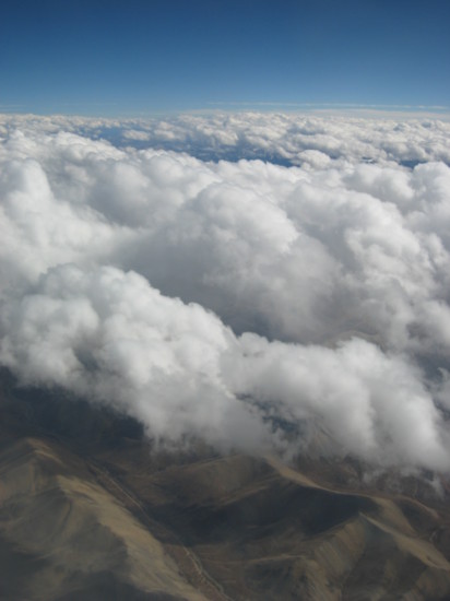 Barren Tibetan landscape seen through the clouds