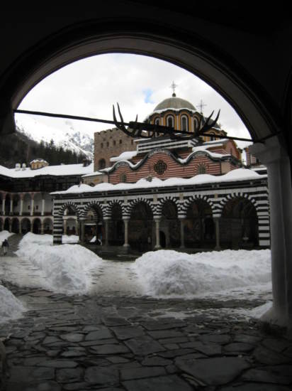 Looking through an archway into the monastery