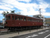 Old railway carriage outside railway station