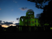 A-bomb building lit up at night
