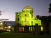A-bomb building lit up at night