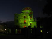 A-bomb building lit up at night