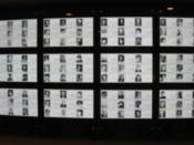Screens that change over time, showing some of those killed by the a-bomb
