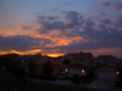 The sun sets over the street where I was staying