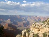Nearby Rock Contrasts With The Darker Canyon Walls