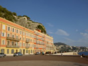 Nice colourful buildings set in front of rugged rocks