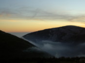 Cloud between hills