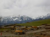 Construction work against a mountain backdrop
