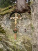 A cross hanging from a tree