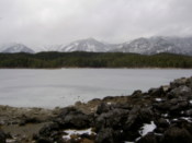 Snowy rocks by the lakeside