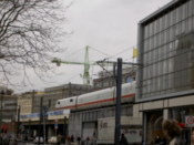 An ICE passes through a station