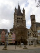 Colourful buildings dwarfed by the chathedral