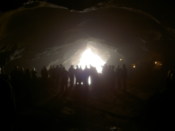 People look outside a cave
