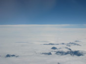 Mountains poke through the clouds