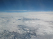 Mountains poke through the clouds