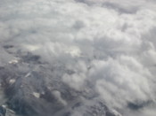 Mountains poke through the clouds
