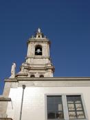 A church tower with a bell