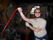 A sunburnt me pretending to drive a train