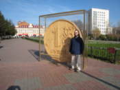 Me by a giant wooden ruble