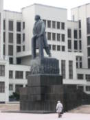 Man walks beneath the Lenin statue